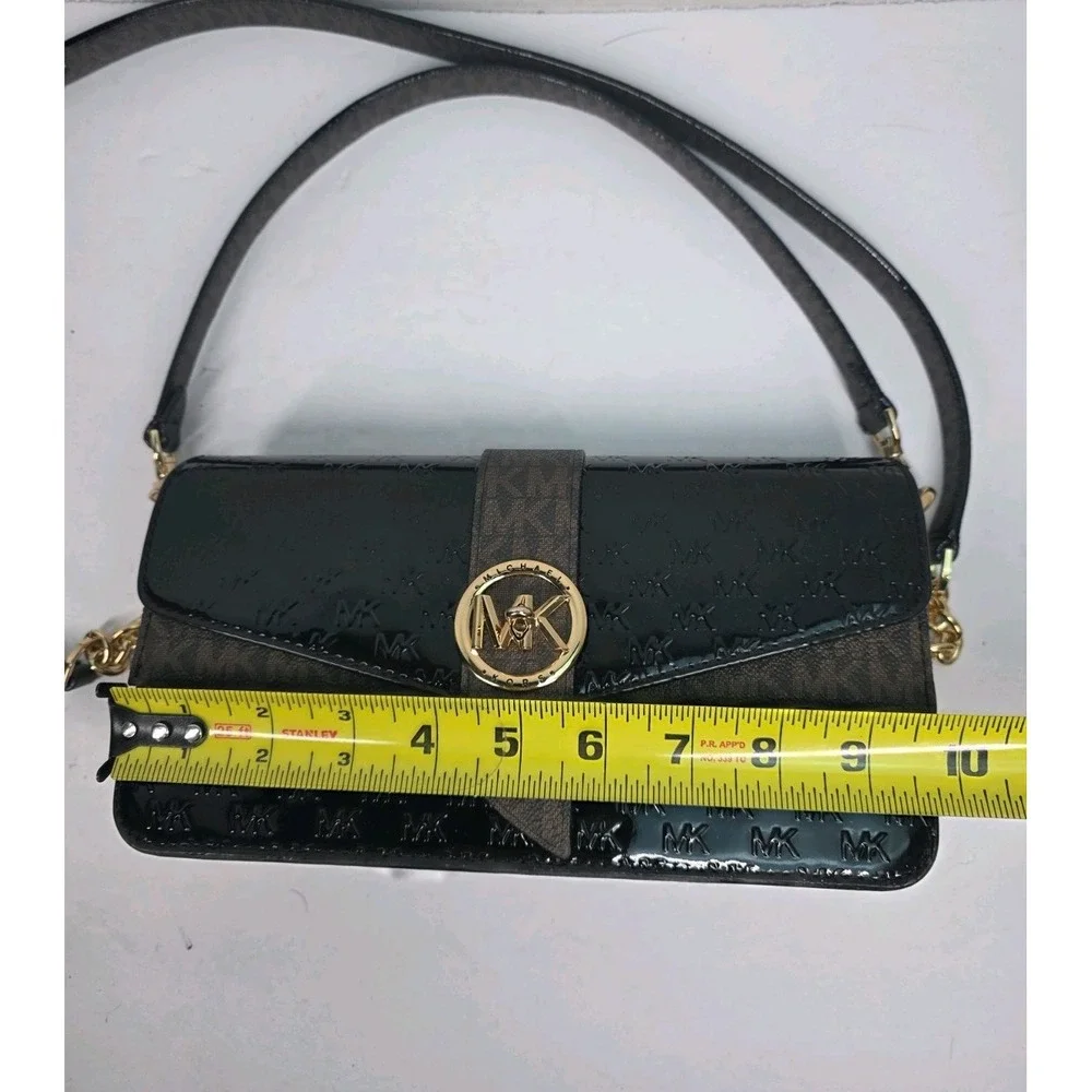 Michael Kors Greenwich medium logo-embossed patent leather shoulder bag in black